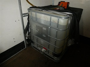 Hong Kong Customs and the Fire Services Department mounted a territory-wide operation targeting illicit fuel activities on June 10. During the operation, officers of the two departments detected two related cases and seized about 3 200 litres of illicit motor spirit, with an estimated market value of about $104,000 and a duty potential of about $20,000. Two persons were arrested, and one vehicle connected with one of the cases was also seized. A vehicle connected with one of the cases was seized, and two persons were arrested. Photo shows an illegal mobile fuelling station raided in Kwai Chung.