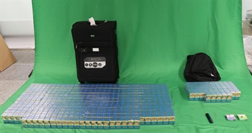 Five incoming passengers were sentenced to six weeks' to four months' imprisonment and fined $1,000 respectively by the Magistrates' Courts today (June 15) for possessing or importing duty-not-paid cigarettes and failing to declare to Customs Officers, in contravention of the Dutiable Commodities Ordinance, as well as for importing alternative smoking products (ASPs), in contravention of the Dutiable Commodities Ordinance and the Import and Export Ordinance. Photo shows the duty-not-paid cigarettes and ASPs seized from the personal baggage of an incoming 40-year-old Chinese male passenger.