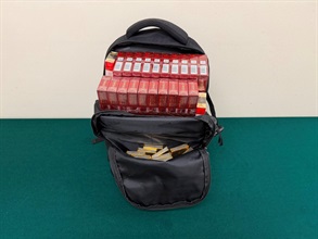 An incoming Chinese female passenger was sentenced to four weeks' imprisonment and fined $1,000 by the Fanling Magistrates' Courts today (June 16) for possessing duty-not-paid cigarettes and failing to declare them to Customs officers, in contravention of the Dutiable Commodities Ordinance. Photo shows the backpack used to conceal the duty-not-paid cigarettes.