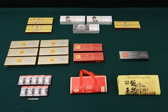 Two incoming male passengers were sentenced to four weeks’ imprisonment with a fine of $1,000, and three months' imprisonment with a fine of $1,000, respectively by the Courts today (June 22) for possessing or importing duty-not-paid cigarettes and failing to declare them to Customs officers, in contravention of the Dutiable Commodities Ordinance. Photo shows the duty-not-paid cigarettes seized from the personal baggage of an incoming 34-year-old local male passenger.