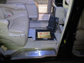 A 58-year-old incoming Chinese male driver was convicted at the West Kowloon Magistrates' Courts today (June 22) for importing duty-not-paid cigarettes and making use of an altered structure of a vehicle for the purpose of smuggling articles, in contravention of the Dutiable Commodities Ordinance and the Import and Export Ordinance. He was sentenced to four months' imprisonment for each of the charges that will run concurrently. Photo shows the duty-not-paid cigarettes concealed inside a compartment installed underneath the vehicle concerned.
