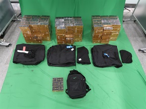 Three incoming passengers were sentenced to three to six months' imprisonment and fined $500 each by the West Kowloon Magistrates' Courts today (July 2) for importing duty-not-paid cigarettes and failing to declare them to Customs officers, in contravention of the Dutiable Commodities Ordinance. Photo shows the duty-not-paid cigarettes seized from the personal baggage of a 28-year-old incoming male passenger.