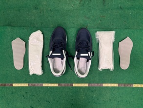 Hong Kong Customs today (July 7) detected one dangerous drug case and seized about 1 kilogram of suspected cocaine with an estimated market value of about $0.8 million at Hong Kong International Airport. Photo shows the suspected cocaine concealed in the shoes.