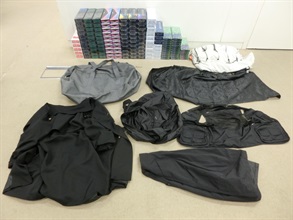 Two incoming air passengers were sentenced to five months' imprisonment by the Kowloon City Magistrates' Courts on July 4 for importing and dealing with duty-not-paid cigarettes, in contravention of the Dutiable Commodities Ordinance (Cap. 109). One of them was also fined $1,000. Photo shows the illicit cigarettes seized from the personal baggage of one of the incoming passengers.