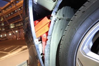A 67-year-old incoming local male driver was convicted and sentenced to three months' imprisonment with a fine of $1,000 by the Tuen Mun Magistrates' Courts today (July 10) for importing duty-not-paid cigarettes, failing to declare them to Customs officers, as well as importing unmanifested cargo, in contravention of the Dutiable Commodities Ordinance and the Import and Export Ordinance. Photo shows the duty-not-paid cigarettes concealed in the interior space of the front bumper of the private car concerned.