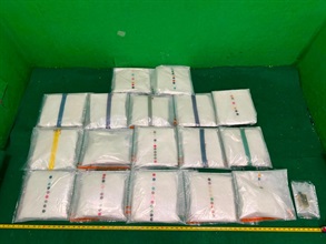 Hong Kong Customs detected a drug trafficking case involving two incoming passengers at Hong Kong International Airport yesterday (July 12) and seized about 28 kilograms of suspected ketamine, about 4kg of suspected MDMA, and two items of suspected alternative smoking products, with an estimated market value of about $11.8 million. Photo shows the suspected ketamine and suspected alternative smoking products seized from the 23-year-old passenger.