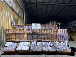 Hong Kong Customs shut down a suspected illicit cigarette and manufactured tobacco storage centre on Lin Ma Hang Road in the North District, New Territories, yesterday (July 13). A total of about 273 800 suspected illicit cigarettes and about 324 kilograms of suspected manufactured tobacco were seized. The total estimated market value was about $3.3 million while the duty potential was about $2.2 million. Two Mainland men connected with the case were arrested. Photo shows the suspected illicit cigarettes and manufactured tobacco seized.