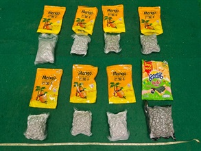 Hong Kong Customs yesterday (July 13) detected a drug trafficking case involving an incoming air passenger at Hong Kong International Airport and seized about 7 kilograms of suspected cannabis buds with an estimated market value of about $1.3 million. Photo shows the suspected cannabis buds seized.