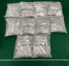 Hong Kong Customs yesterday (July 16) detected two drug trafficking cases involving air passengers at Hong Kong International Airport and seized about 21 kilograms of suspected cannabis buds with an estimated market value of about $3.9 million. Two men were arrested. Photo shows the batch of the suspected cannabis buds seized from the checked-in suitcase of the 19-year-old Malaysian male passenger.