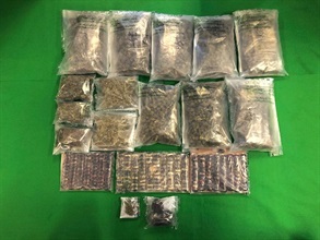 Hong Kong Customs yesterday (January 12) seized two batches of suspected dangerous drugs in Tsuen Wan and Sha Tin, including about 6 kilograms of suspected cannabis buds, about 3.5kg of suspected heroin, about 1.7kg of suspected liquid cocaine, about 410 grams of suspected ketamine, about 170g of suspected methamphetamine and about 5g of suspected crack cocaine. The total estimated market value is about $8.3 million. Photo shows the suspected cannabis buds and suspected heroin seized.