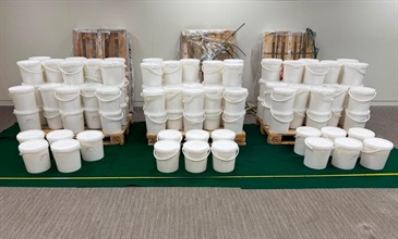 Hong Kong Customs detected a dangerous drug case on July 16, and seized about 131 kilograms of suspected ketamine, with an estimated market value of about $51.4 million. Three persons suspected to be connected with the case were arrested. Photo shows 17 plastic buckets (two front rows) with suspected ketamine concealed inside.