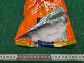 Hong Kong Customs yesterday (July 21) and today (July 22) detected three drug trafficking cases involving incoming air passengers at Hong Kong International Airport and seized a total of about 5.4 kilograms of suspected cocaine and about 14kg of suspected methamphetamine, with a total estimated market value of about $11 million. Three men were arrested. Photo shows the suspected methamphetamine seized and the beverage package used to conceal the drug in the third case.