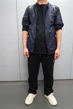 An incoming Mainland male passenger was sentenced to six weeks' imprisonment with a fine of $1,000 by the Fanling Magistrates' Courts today (August 3) for possessing duty-not-paid cigarettes and failing to declare them to Customs officers, in contravention of the Dutiable Commodities Ordinance. Photo shows the 39-year-old incoming Mainland male passenger concealing duty-not-paid cigarettes around his back, waist and both lower legs with plastic tape, covered by his clothes.