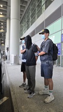 Hong Kong Customs yesterday (August 7) detected two drug trafficking cases at Hong Kong International Airport. About 9.8 kilograms of suspected cannabis buds with a total estimated market value of about $2 million were seized. Two men were arrested. Photos shows the arrested person (centre) involved in the second case.