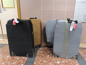 Two incoming air passengers were each sentenced to 10 months' imprisonment by the West Kowloon Magistrates' Courts today (August 12) for dealing with duty-not-paid cigarettes, in contravention of the Dutiable Commodities Ordinance (Cap. 109). Photo shows the personal baggage, which duty-not-paid cigarettes were concealed by one of the incoming passengers.