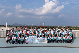 Hong Kong Customs organised the Hainan Aerospace Technology and Sustainable Development Exploration Tour for Customs YES from August 7 to 12. Photo shows the Commissioner of Customs and Excise, Mr Chan Tsz-tat (third row, centre), the Director of Customs Liaison Division, Police Liaison Department, Liaison Office of the Central People's Government in the Hong Kong Special Administrative Region, Ms Zhuang Yan (third row, sixth right), the Honorary Founding Executive Director of the Executive Committee of Customs YES, Mr Edgar Kwan (third row, sixth left), the Deputy Executive Director, Ms Amy Chan (third row, fifth right), the Directors, Ms Sylvia Lee (third row, fifth left), Dr Mark Mak (third row, fourth right), Dr Charles Ng (third row, third right), the Honorary Presidents of the Honorary Presidents’ Association, Mr Arthur Mui (third row, third left) and Ms Keren Leung (third row, fourth left), leading Customs YES members to visit the Wenchang Yaoguang Rocket Viewing Platform to witness the launch of a national satellite at close range.