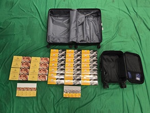An incoming Vietnamese male passenger was sentenced to three months' imprisonment and fined $1,000 by the West Kowloon Magistrates' Courts today (August 19) for importing duty-not-paid cigarettes and failing to declare them to Customs officers, in contravention of the Dutiable Commodities Ordinance. Photo shows the duty-not-paid cigarettes seized.