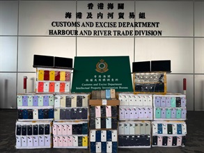 Hong Kong Customs from August 12 to 14 seized a total of about 25 000 suspected counterfeit goods and 1 000 suspected illicit cigarettes with a total estimated market value of about $8.5 million at the Tuen Mun River Trade Terminal. Photo shows some of the suspected counterfeit goods seized.