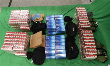 Two incoming Mainland passengers were sentenced to ten months' imprisonment with a fine of $1,000, and eight months' imprisonment with a fine of $2,000, respectively at the West Kowloon Magistrates' Courts today today (August 27) for importing duty-not-paid cigarettes and failing to declare them to Customs officers in contravention of the Dutiable Commodities Ordinance. Photo shows the illicit cigarettes seized from the personal baggage of the incoming 42-year-old Mainland female passenger.