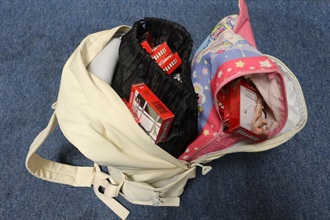 An incoming Mainland female passenger was sentenced to eight weeks' imprisonment by the Fanling Magistrates' Courts today (August 31) for possessing duty-not-paid cigarettes and failing to declare them to Customs officers, in contravention of the Dutiable Commodities Ordinance. Photo shows the duty-not-paid cigarettes seized in the case.