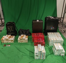 Two incoming male passengers were each sentenced to six months' imprisonment with a fine of $2,000 by the West Kowloon Magistrates' Courts today (September 7) for importing duty-not-paid cigarettes and failing to declare them to Customs officers, in contravention of the Dutiable Commodities Ordinance. Photo shows the duty-not-paid cigarettes seized from the personal baggage of the 42-year-old incoming Mainland male passenger.