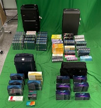 An incoming female passenger was sentenced to six months' imprisonment and fined $4,000 at the West Kowloon Magistrates' Courts today (September 9) for importing duty-not-paid cigarettes, failing to declare them to Customs officers, as well as importing alternative smoking products, in contravention of the Dutiable Commodities Ordinance and the Import and Export Ordinance. Photo shows the duty-not-paid cigarettes and alternative smoking products seized.