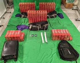 An incoming male passenger was sentenced to eight months' imprisonment and fined $2,000 by the West Kowloon Magistrates' Courts today (September 18) for importing duty-not-paid cigarettes and failing to declare them to Customs officers, in contravention of the Dutiable Commodities Ordinance. Photo shows the duty-not-paid cigarettes seized.