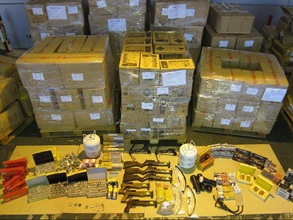 Hong Kong Customs seized various contraband from two containers. The photo shows the unmanifested cargoes including crossbows, aphrodisiac pills and Chinese medication, vehicle parts and refrigerants.