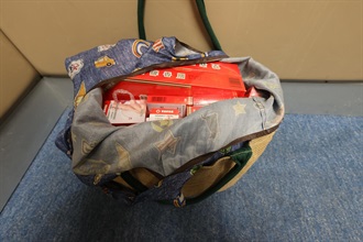 An incoming Mainland female passenger was sentenced to four weeks' imprisonment with a fine of $1,500 by the Fanling Magistrates' Courts today (October 2) for possessing duty-not-paid cigarettes and failing to declare them to Customs officers, in contravention of the Dutiable Commodities Ordinance. Photo shows the duty-not-paid cigarettes seized by Customs officers from the personal baggage of the incoming Mainland female passenger.