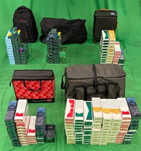 Two incoming passengers were respectively sentenced to four and eight months’ imprisonment and each fined $2,000 by the West Kowloon Magistrates' Courts today (October 5) for importing duty-not-paid cigarettes and failing to declare them to Customs officers, in contravention of the Dutiable Commodities Ordinance. Photo shows the duty-not-paid cigarettes seized from the personal baggage of the incoming male passenger.