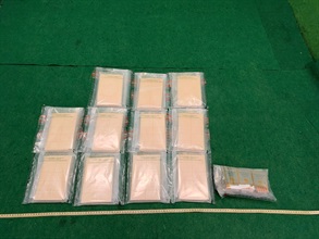 Hong Kong Customs detected a drug trafficking case involving a passenger at Hong Kong International Airport today (October 6) and seized about 5.5 kilograms of suspected cocaine and 45 duty-not-paid cigarettes, with a total estimated market value of about $4.1 million. Photo shows the suspected cocaine and duty-not-paid cigarettes seized.