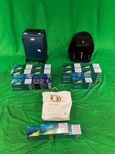 An incoming female passenger was sentenced to three months' imprisonment and fined $1,000 by the West Kowloon Magistrates' Courts today (October 7) for importing duty-not-paid cigarettes and failing to declare them to Customs officers, in contravention of the Dutiable Commodities Ordinance. Photo shows the duty-not-paid cigarettes seized.