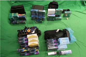 An incoming male passenger was sentenced to 11 months' imprisonment and fined $2,000 by the West Kowloon Magistrates' Courts today (October 9) for importing duty-not-paid cigarettes, failing to declare them to Customs officers, as well as importing alternative smoking products, in contravention of the Dutiable Commodities Ordinance and the Import and Export Ordinance. Photo shows the duty-not-paid cigarettes and alternative smoking products seized.