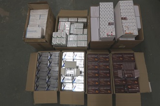 Hong Kong Customs detected two suspected smuggling cases involving river trade vessels on October 9 and 13 respectively. Large batches of suspected smuggled goods with a total estimated market value of about $33 million were seized. Photo shows some of the suspected smuggled pharmaceutical products seized.