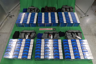 An incoming male passenger was sentenced to nine months' imprisonment and fined $2000 by the West Kowloon Magistrates' Courts today (October 26) for importing duty-not-paid cigarettes and failing to declare them to Customs officers, in contravention of the Dutiable Commodities Ordinance. Photo shows the duty-not-paid cigarettes seized.