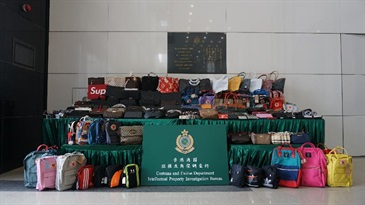 Hong Kong Customs conducted special operations against the sale of counterfeit goods in Central and Mong Kok on January 5 and January 7 respectively. About 10 000 items of suspected counterfeit goods, including handbags, belts, watches and clothing, with an estimated market value of about $4 million were seized. Photo shows some of the suspected counterfeit goods seized.
