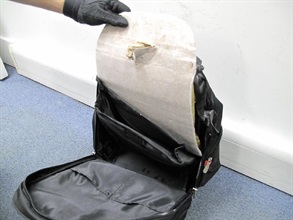 Methamphetamine concealed in the false compartment of a luggage case.