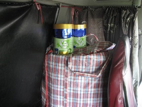 The driver placed the nylon bags in which undeclared milk powder was concealed inside the driving compartment and used curtain to cover the compartment window in a bid to evade Customs detection.