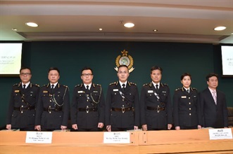 The Commissioner of Customs and Excise, Mr Roy Tang (centre); the Deputy Commissioner, Mr Hermes Tang (third left); the Assistant Commissioner (Excise and Strategic Support), Mr Jimmy Tam (second left); the Assistant Commissioner (Boundary and Ports), Mr Lai Lau-pak (first left); the Assistant Commissioner (Administration and Human Resource Development), Mr Lin Shun-yin (third right); the Assistant Commissioner (Intelligence and Investigation), Ms Louise Ho (second right); and the Head of Trade Controls, Mr Lam Po-chuen (first right), at the 2015 year-end review press conference today (February 4).