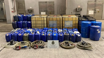 Hong Kong Customs today (January 20) smashed an illicit refuelling station in Yuen Long and seized about 4 100 litres of suspected illicit motor spirit with an estimated market value of about $83,000 and a duty potential of about $25,000. Photo shows the suspected illicit motor spirit and oil refilling apparatus seized.