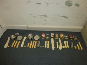 Suspected cocaine concealed in the two biscuits cans and four tea cans.