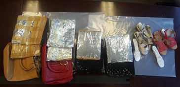 Suspected cocaine concealed in shoes, folders and handbags.