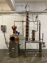 Hong Kong Customs yesterday (April 15) conducted an enforcement operation in Tsuen Wan and detected the first case ever of using imported gin from overseas to disguise as locally-distilled gin for sale. During the operation, a total of 3 046 bottles of gin suspected to be involved with the case, a batch of labels and a set of still were seized with an estimated market value of about $1.5 million in total. Photo shows the set of still seized.