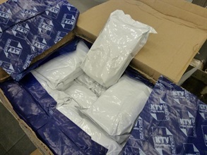 Suspected cold tablets packed in tin foil bags which were wrapped with carbon paper to evade Customs X-ray checking.