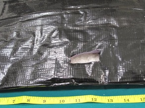 Methamphetamine seized from the false compartment of the suitcase.