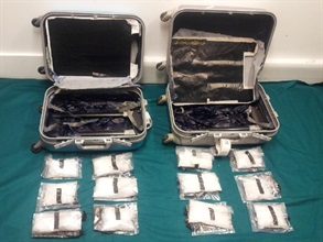 Methamphetamine concealed in the false compartments of two suitcases.