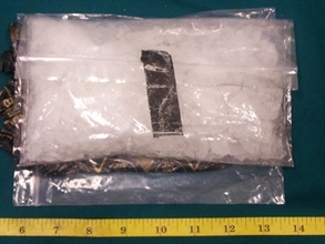Methamphetamine seized from the false compartment of a suitcase.