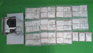 Hong Kong Customs seized about 17.2 kilograms of suspected heroin with an estimated market value of about $14.9 million at Lok Ma Chau Control Point on June 11. This is the largest drug trafficking case detected by Customs at land boundary control points this year. Photo shows the suspected heroin seized and one of the range hoods used to conceal the dangerous drugs.