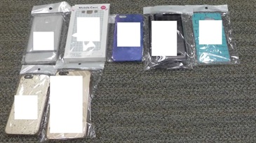 Suspected counterfeit phone cases seized by Customs.