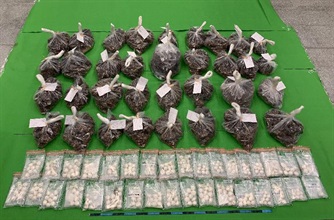 Hong Kong Customs seized about 9.5 kilograms of suspected cocaine at Hong Kong International Airport on June 29 with an estimated market value of about $11 million. Photo shows the suspected cocaine seized and the gum used to conceal the dangerous drugs.